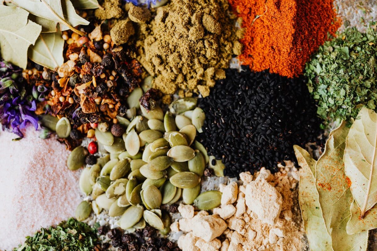 Vibrant collection of spices and seeds perfect for culinary backgrounds.